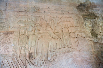 Stone Carving, all around on the wall at Angkor wat.
