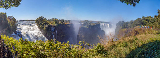 Patorama of the Victoria falls which is the largest curtain of water in the world (1708m wide). The falls and the surrounding area is the National Parks and World Heritage Site - Zambia, Zimbabwe