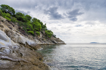 Gorgeous scenery by the sea under a cloudy sky in Sithonia, Chalkidiki, Greece 