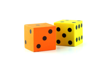 Yellow and Orange rubber dice on white background