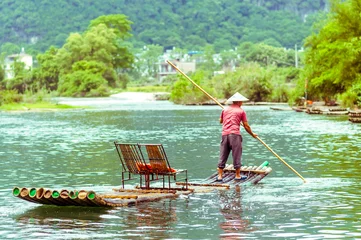 Foto op Canvas Local with Bamboo on Li river in Yangshuo China © streetflash