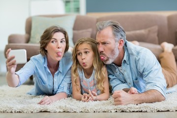 Family taking selfie from mobile phone