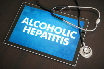Alcoholic hepatitis (liver disease) diagnosis medical concept on tablet screen with stethoscope - obrazy, fototapety, plakaty