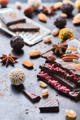 Stack of chocolate bars and praline truffle