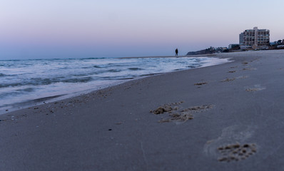 man walking on the beach of Herzliya