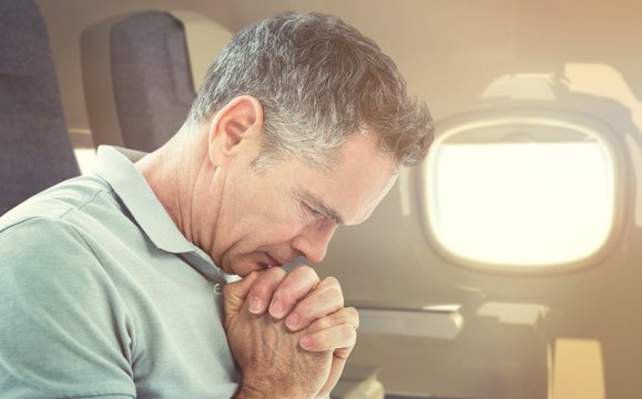 Composite Image Of Tensed Man Standing Against Window 