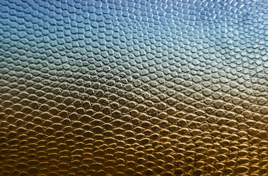 Blue and golden snake skin texture background