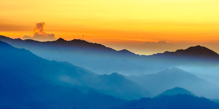 Orange Sunset With Fog In The Mountains 