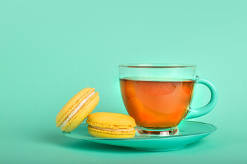 Tea with yellow macaroons