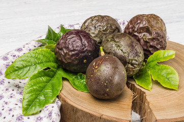 Passion fruits on wooden background