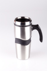Stainless steel coffee mug isolated on white