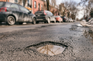 Large pothole in Montreal, Canada. - Powered by Adobe