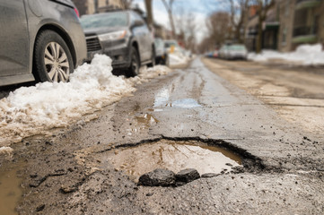 Large pothole in Montreal, Canada.
