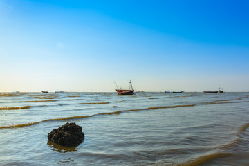 Fototapeta na wymiar Boat on the beach background with blue sky