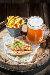 Tasty smelt fish and chips with cold beer