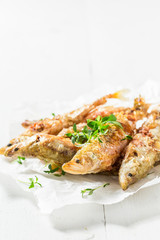 Tasty roasted smelt fish with salt and herbs