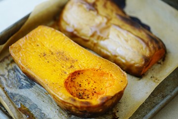 Roasted butternut squash on a baking sheet