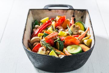 Grilled vegetables with potatoes, carrots and peppers in casserole