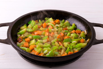 Cooking. Bell pepper, carrot and onion stew in pan