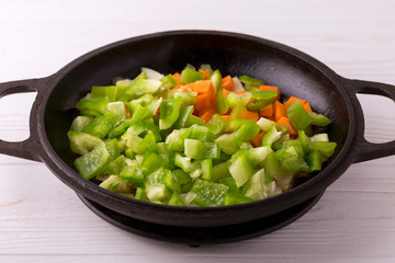 Cooking. Bell pepper, carrot and onion stew in pan