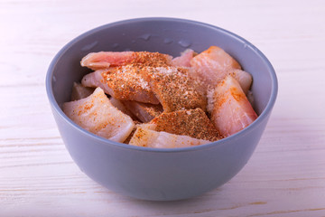 Ingridients for fried fish. Chopped raw fillet with spices