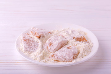 Ingridients for fried fish. Chopped fillet in fleur