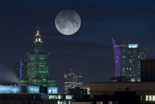 Fototapeta Moon over Warsaw city
