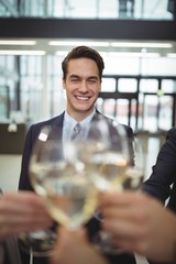 Businesspeople toasting glasses of champagne