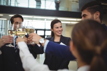 Businesspeople toasting glasses of champagne