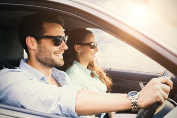 couple in a car smiling 
