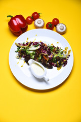 cooked meat with fresh salad leaves and sweet pepper