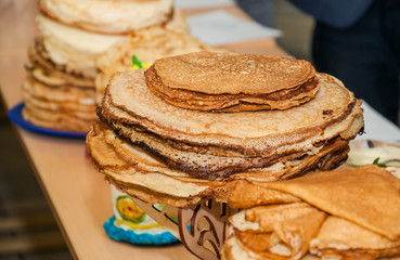 A stacks of pancakes during the celebration Russian Shrovetide (pancake week) in school