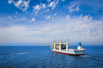 Fototapeta premium Heavy lift vessel leaving a port
