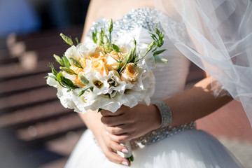 Beautiful wedding bouquet hands of the bride