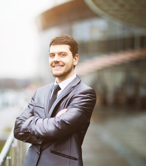 Happy mature business man looking at camera with satisfaction office