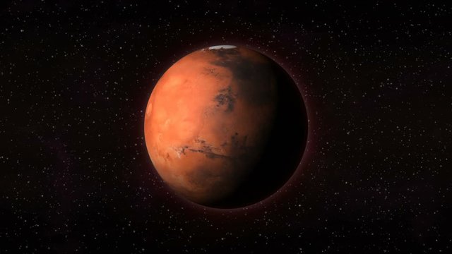 Planet Mars in outer space, spinning around its axis with stars in the background. Seamlessly loopable computer generated animation. Mars texture is public domain provided by NASA.