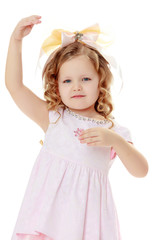 Girl shows the doll.