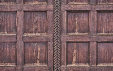 Obraz premium Wooden panel of burgundy-brown color from square laths and decorative oblique wood from the center, close-up