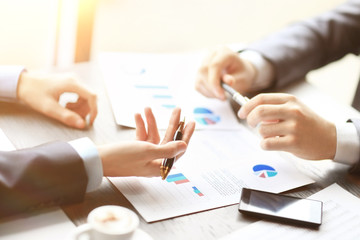 Image two young businessmen discussing document at meeting