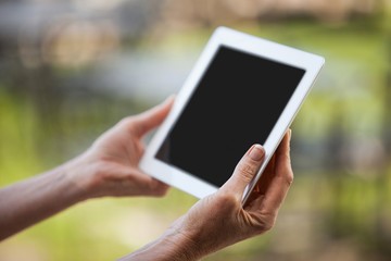 Hands of female staff using digital tablet