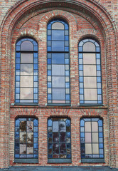 Glass window with stained-glass windows on the church building