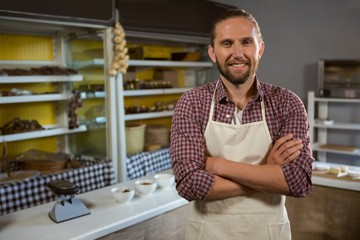 Obraz premium Portrait of male staff standing with hands crossed