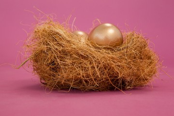 Golden Easter eggs in the nest