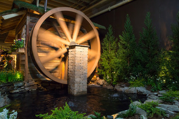 Landscape design featuring a water wheel