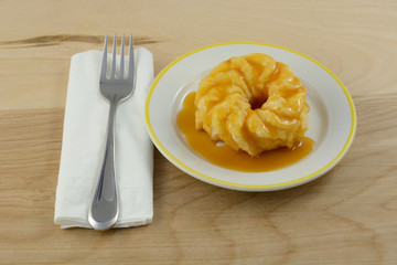 Decadent breakfast donut with butterscotch syrup