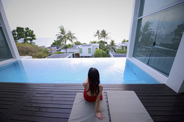 Relaxing by a private roof-top pool in the Aleenta Phuket Resort, Thailand