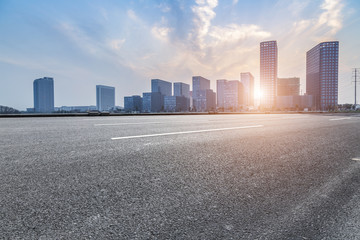 skyline and modern business office buildings with empty concrete square floor