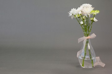 Flower vase tied with ribbon
