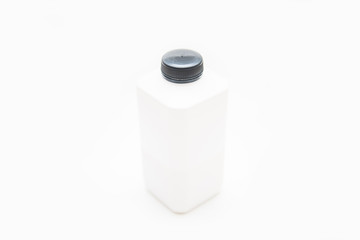 white plastic bottle of milk