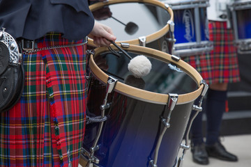 Orchestra performing outdoot closep drum kilt